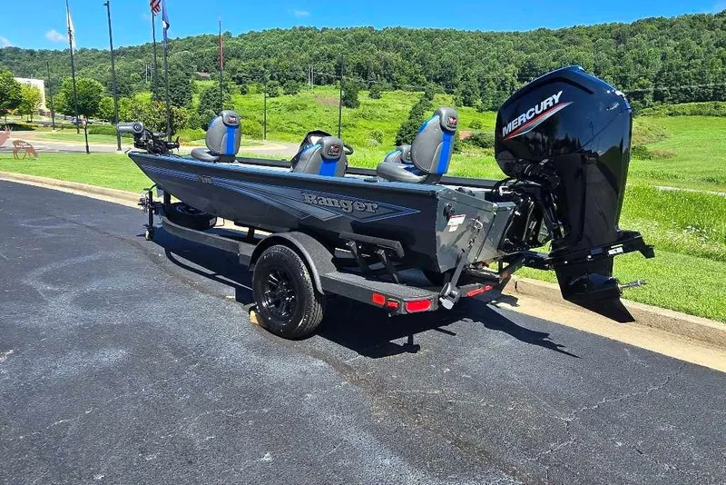 Slide: The Image of 2027 Ranger RT178 boat with Mercury engine on trailer, parked outdoors. - 4