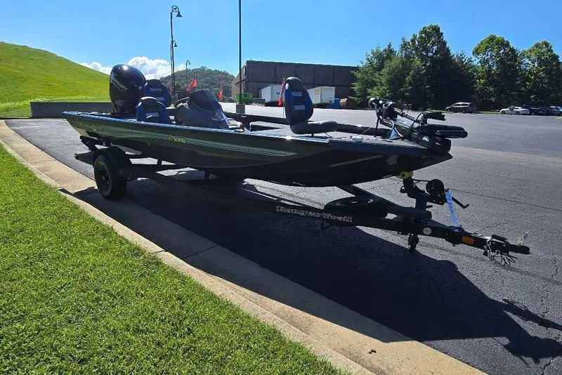 Slide: The Image of 2027 Ranger RT178 boat on trailer in sunny parking lot. - 8