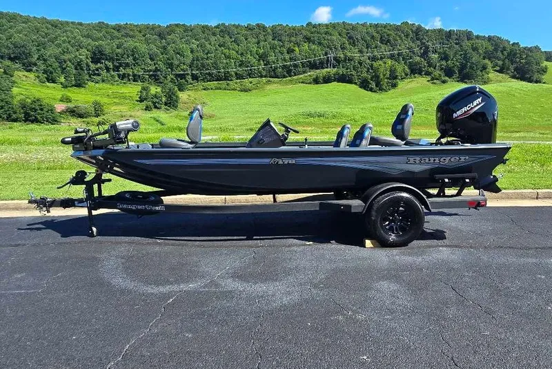 The Image of 2027 Ranger RT178 boat on trailer, parked on asphalt with green hills in background. - 0