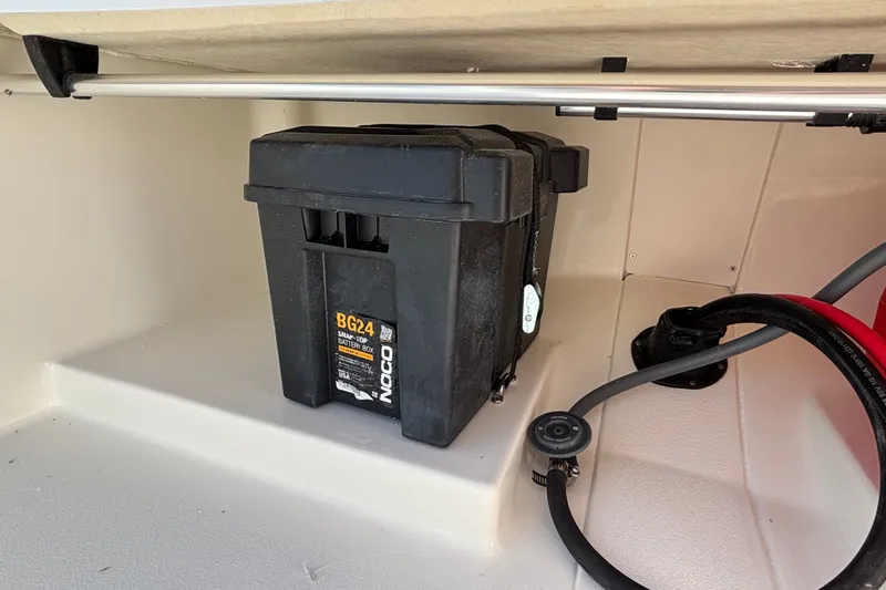 Slide: The Image of Battery compartment of 2026 Mako Pro Skiff 13 CC with Noco BG24 battery box. - 13