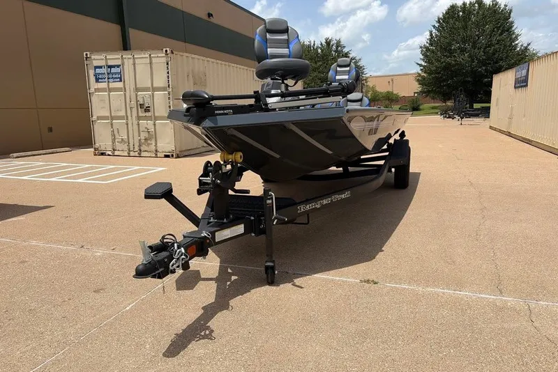 Slide: The Image of 2027 Ranger RT188C boat on trailer in industrial outdoor setting. - 1