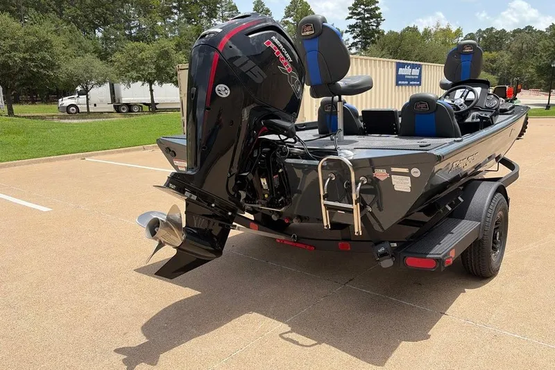 Slide: The Image of 2027 Ranger RT188C boat with powerful outboard motor in a parking lot. - 5