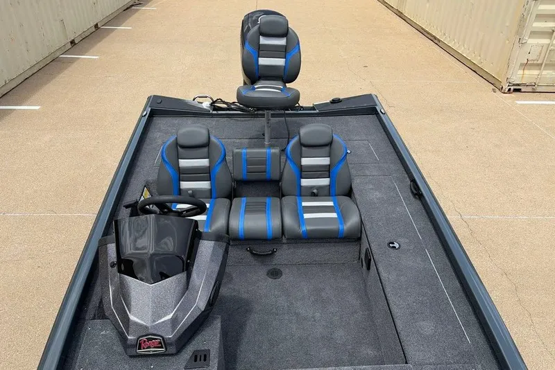 Slide: The Image of 2027 Ranger RT188C boat interior with gray and blue seating, steering console, and spacious deck. - 8