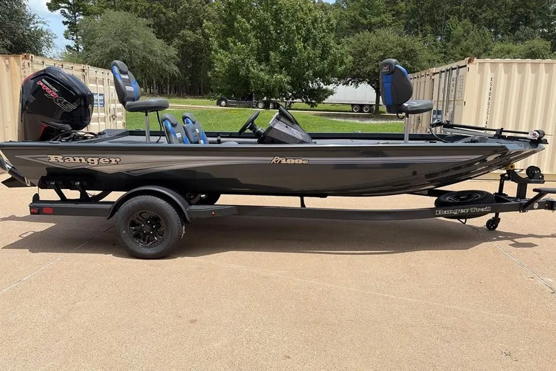 The Image of 2027 Ranger RT188C fishing boat on trailer, parked outdoors. - 0