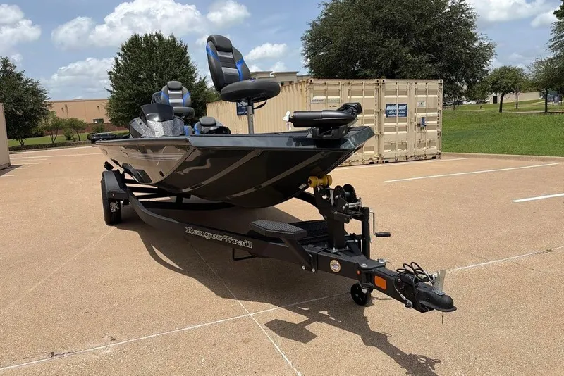 Slide: The Image of 2027 Ranger RT188C boat on trailer in parking lot, sunny day. - 2
