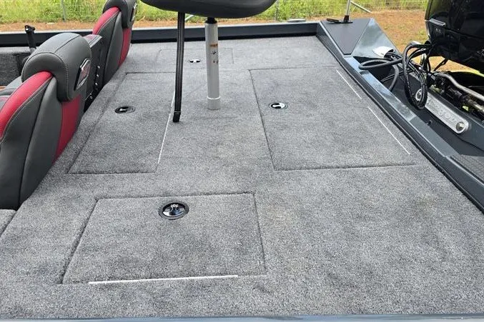 Slide: The Image of 2027 Ranger RT178C boat interior with gray carpet and seating. - 14