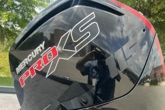 Slide: The Image of Mercury Pro XS engine on a 2027 Ranger RT188C boat, outdoors. - 8