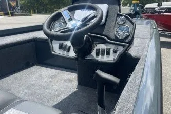 Slide: The Image of 2027 Ranger RT188C boat cockpit with steering wheel and control panel. - 7