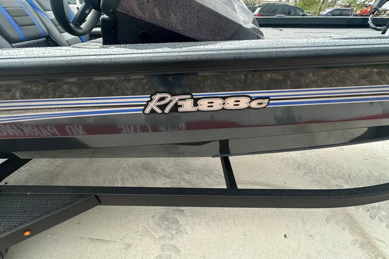 Slide: The Image of 2027 Ranger RT188C boat with sleek design and blue accents on a trailer. - 8