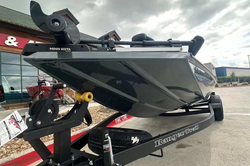 Slide: The Image of 2027 Ranger RT188C boat on trailer with Minn Kota motor, displayed outdoors. - 5