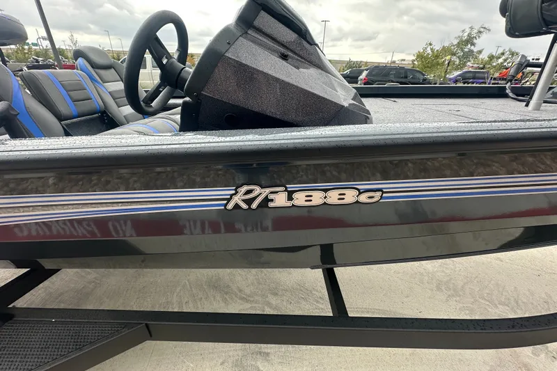 Slide: The Image of 2027 Ranger RT188C boat with sleek design and blue-accented seats. - 9