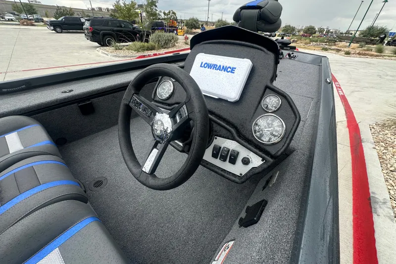 Slide: The Image of 2027 Ranger RT188C boat interior with steering wheel and Lowrance electronics. - 19
