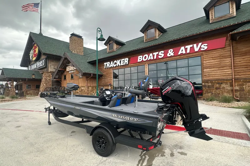 The Image of 2027 Ranger RT188C boat displayed outside Tracker Boats & ATVs store. - 1