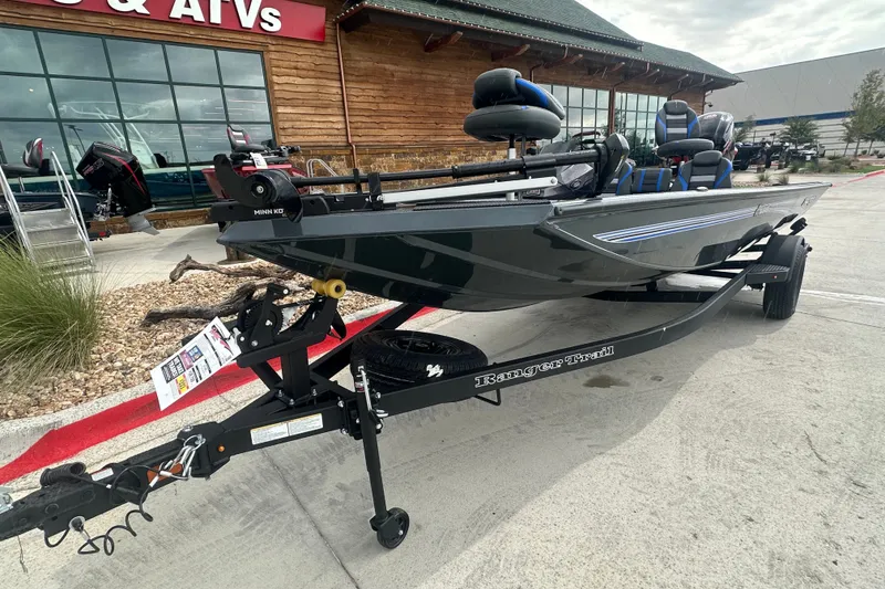 Slide: The Image of 2027 Ranger RT188C boat on trailer outside dealership. - 4