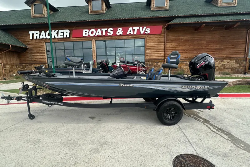 Slide: The Image of 2027 Ranger RT188C boat on trailer outside Tracker Boats & ATVs store. - 3