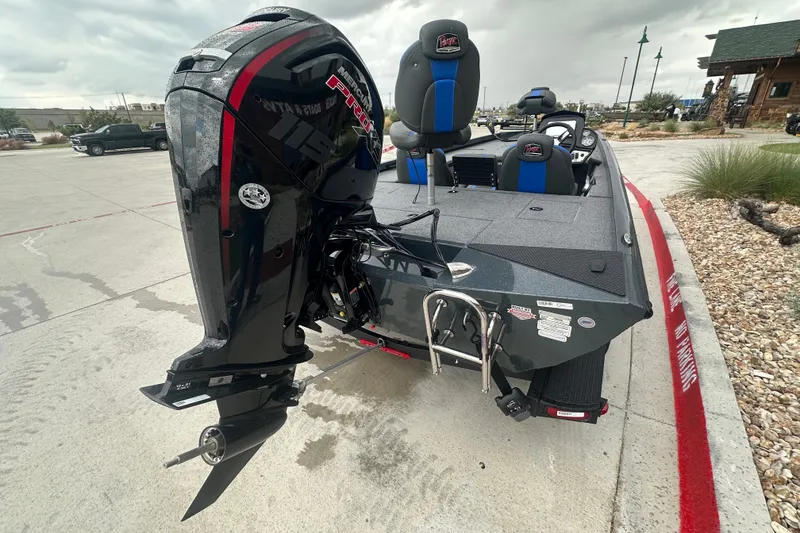 Slide: The Image of 2027 Ranger RT188C boat with powerful outboard motor, parked on concrete surface. - 11