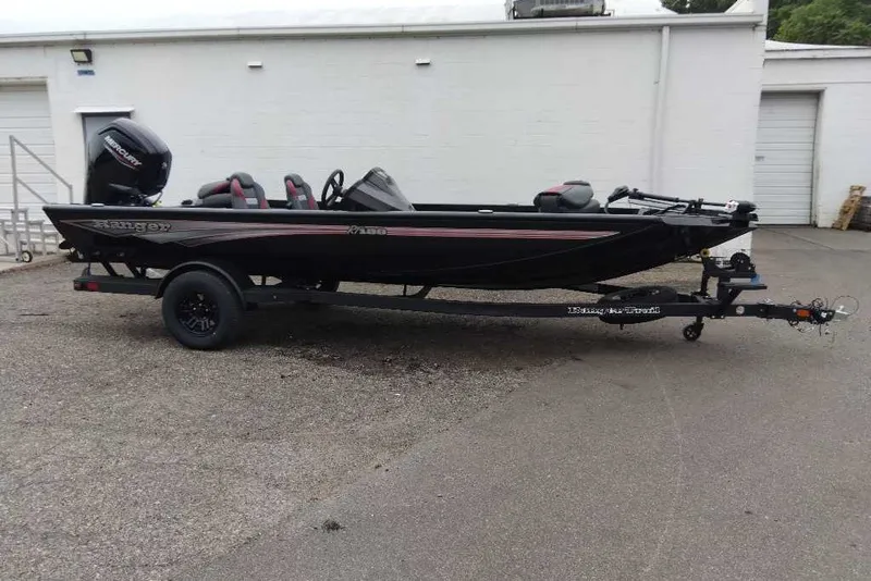 The Image of 2027 Ranger RT188 boat on trailer, black exterior, parked outdoors. - 0
