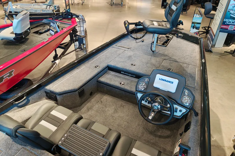 Slide: The Image of 2027 Ranger RT178 fishing boat interior with steering wheel and Lowrance display. - 14
