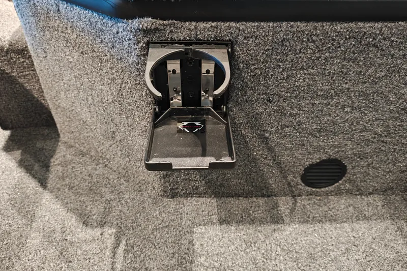 Slide: The Image of 2027 Ranger RT178 boat cup holder on carpeted interior surface. - 33