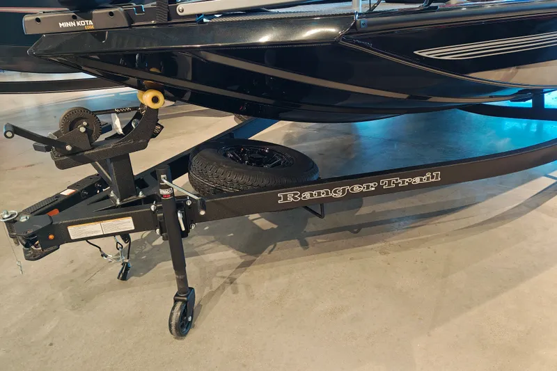 Slide: The Image of 2027 Ranger RT178 boat trailer with Minn Kota Edge motor, displayed indoors. - 7