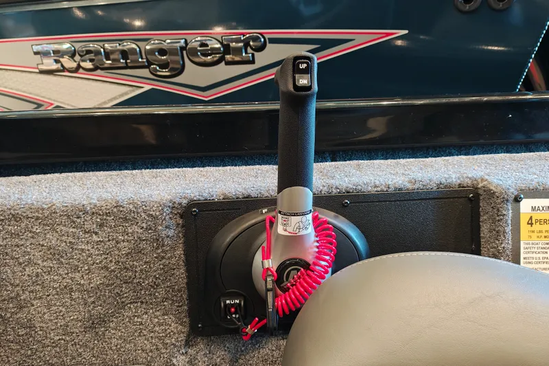 Slide: The Image of 2027 Ranger RT178 boat control panel with throttle lever and safety lanyard. - 24