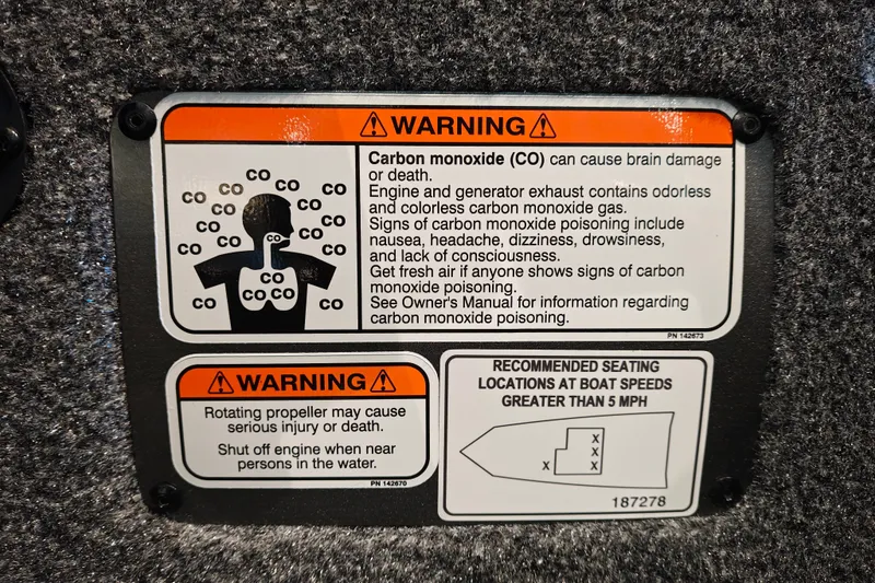 Slide: The Image of Warning labels on 2027 Ranger RT178 boat about carbon monoxide and propeller safety. - 23