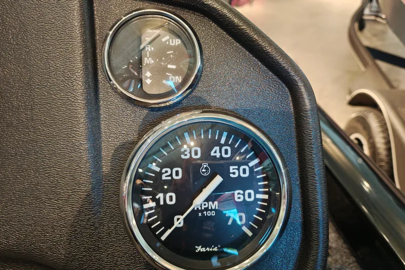 Slide: The Image of Close-up of 2027 Ranger RT178 boat dashboard with RPM and trim gauges. - 19