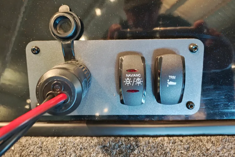 Slide: The Image of Control panel of 2027 Ranger RT178 boat with navigation and trim switches. - 37