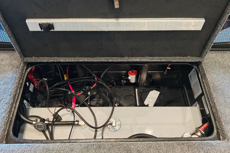 Slide: The Image of Open compartment of 2027 Ranger RT178 boat showing wiring and components. - 44