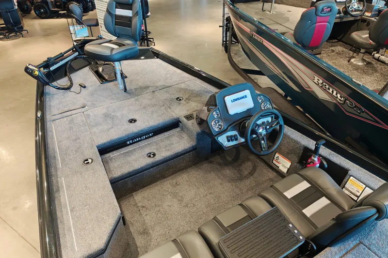 Slide: The Image of 2027 Ranger RT178 fishing boat interior with steering console and seating. - 13