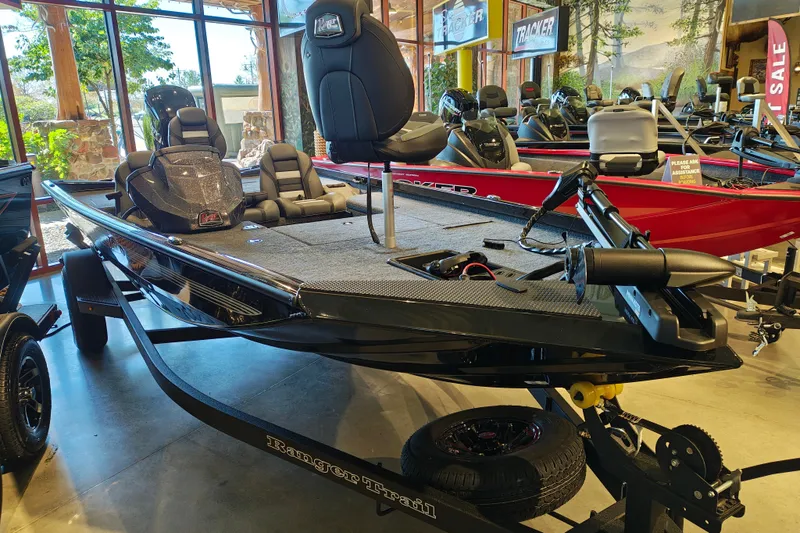 Slide: The Image of 2027 Ranger RT178 boat displayed in showroom, featuring sleek design and modern seating. - 6