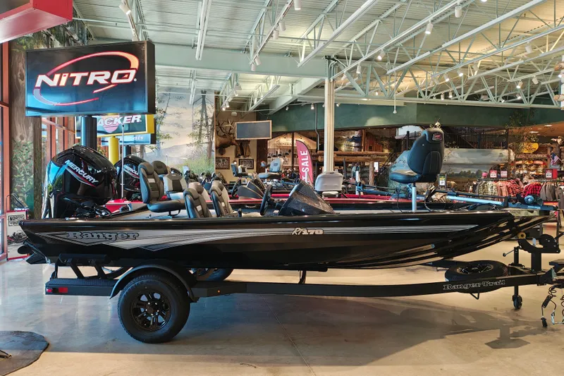 The Image of 2027 Ranger RT178 boat displayed in showroom with Mercury engine. - 1
