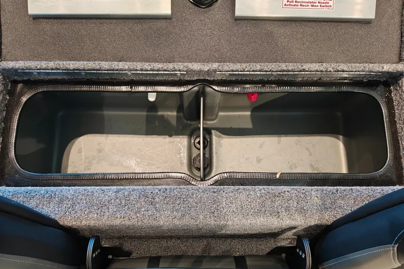 Slide: The Image of 2027 Ranger RT178 boat storage compartment with carpeted interior and dual sections. - 43