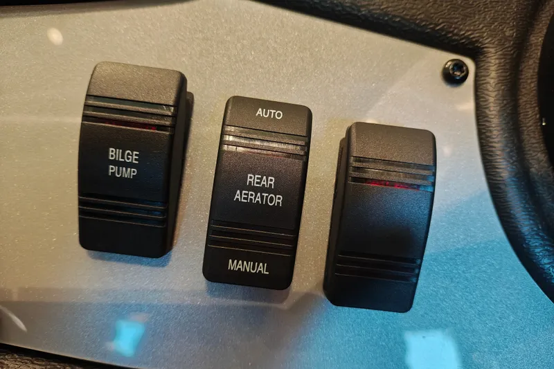 Slide: The Image of Control panel of 2027 Ranger RT178 with bilge pump and rear aerator switches. - 20