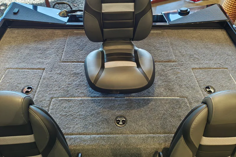 Slide: The Image of Interior of a 2027 Ranger RT178 boat featuring cushioned seating and carpeted flooring. - 41