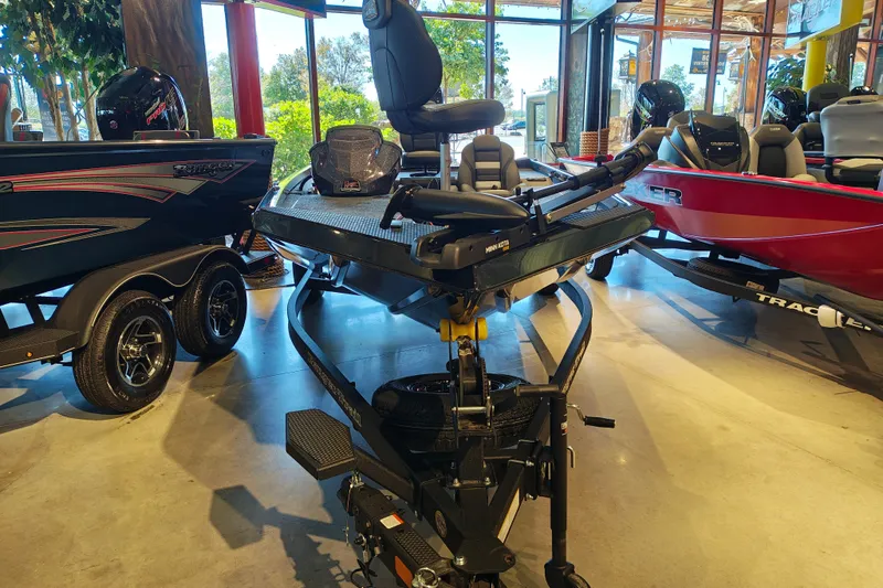 Slide: The Image of 2027 Ranger RT178 fishing boat displayed in a showroom with other models. - 5