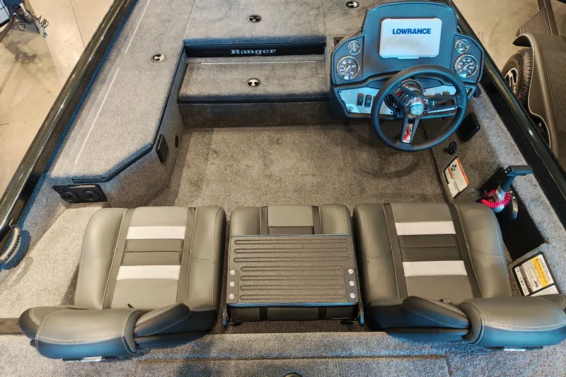 Slide: The Image of 2027 Ranger RT178 boat interior with steering console and seating arrangement. - 15