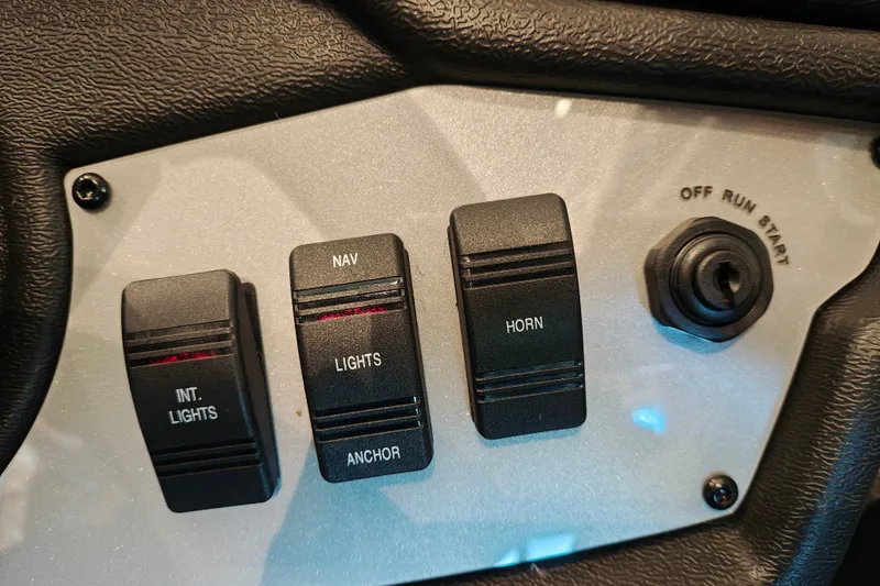 Slide: The Image of Control panel of 2027 Ranger RT178 with switches for lights, horn, and ignition. - 21