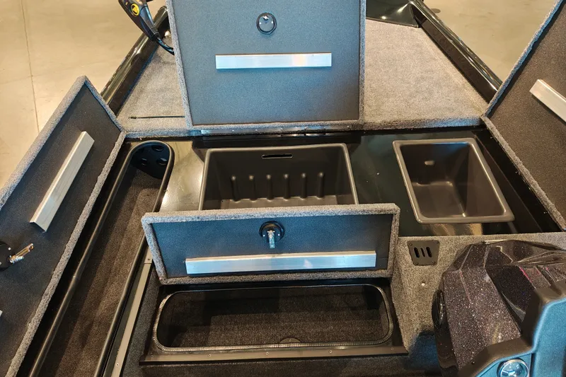 Slide: The Image of 2027 Ranger RT178 boat storage compartments with open lids and organized interior layout. - 27