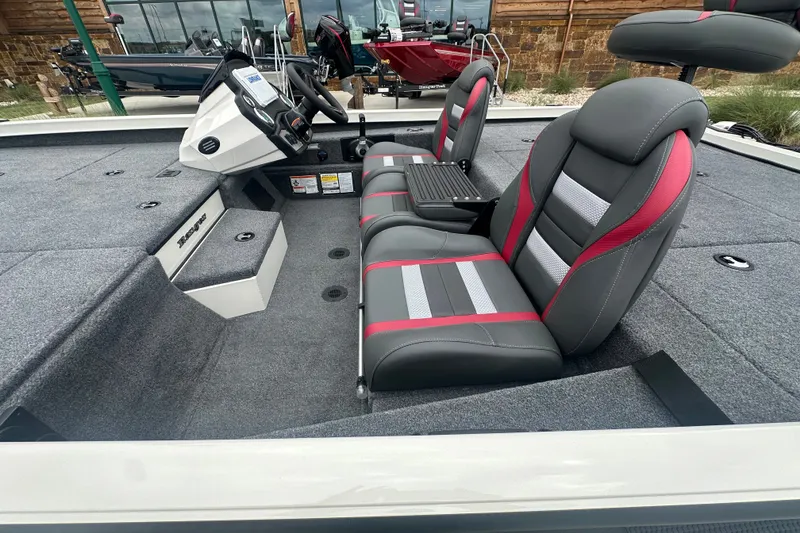 Slide: The Image of 2027 Ranger RT198P boat interior with gray and red seating, modern dashboard. - 15