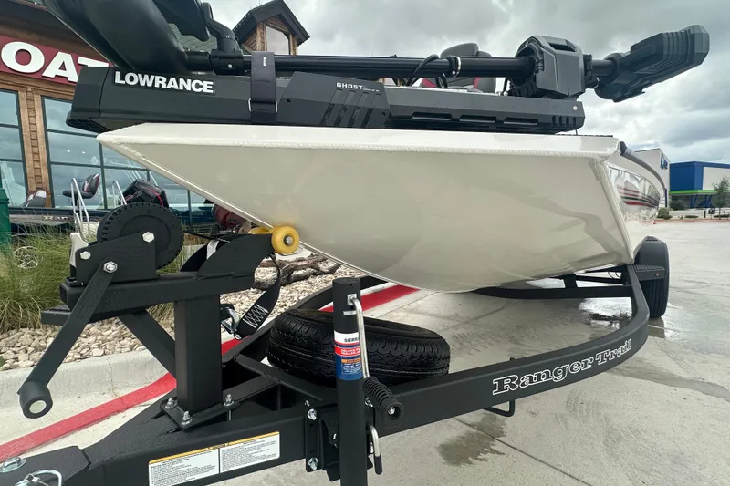 Slide: The Image of 2027 Ranger RT198P boat on trailer with Lowrance equipment, parked outdoors. - 4