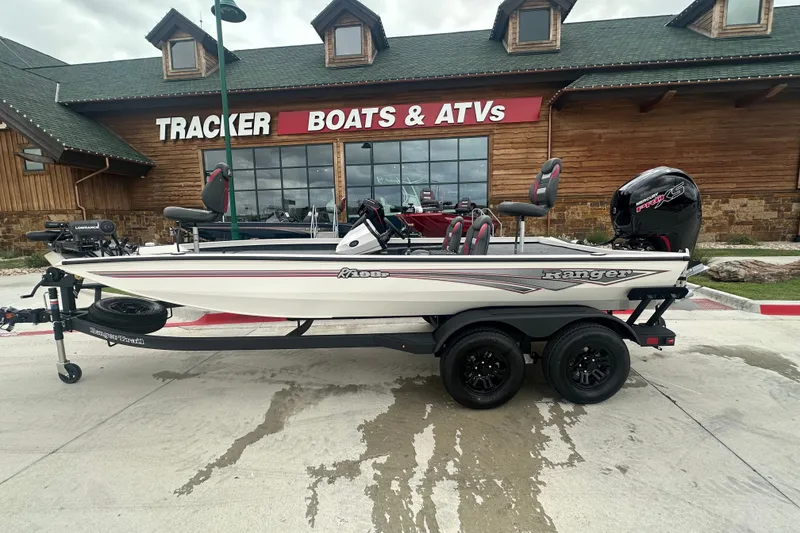 Slide: The Image of 2027 Ranger RT198P boat on trailer outside Tracker Boats & ATVs store. - 3