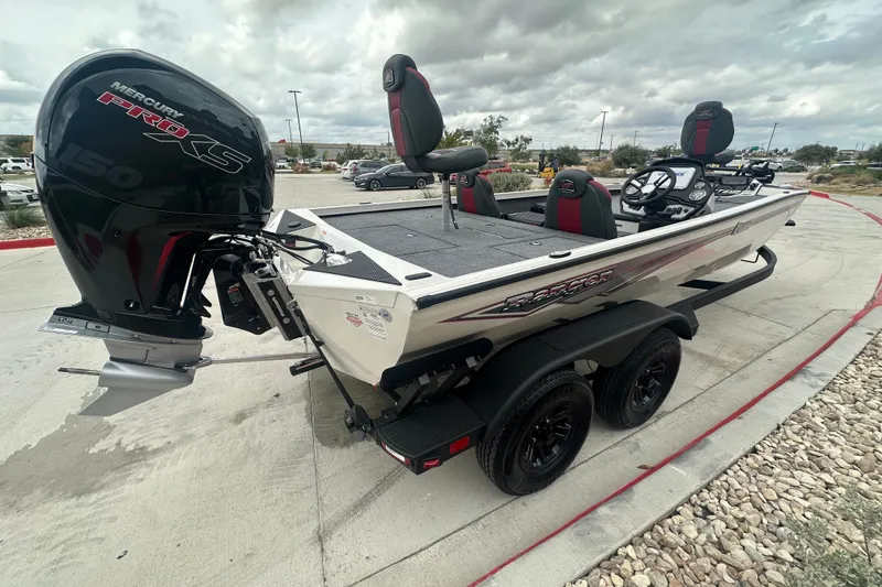 Slide: The Image of 2027 Ranger RT198P boat with Mercury Pro XS engine, parked on concrete under cloudy skies. - 7