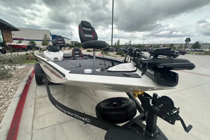 Slide: The Image of 2027 Ranger RT198P fishing boat on trailer, featuring modern seating and equipment. - 5
