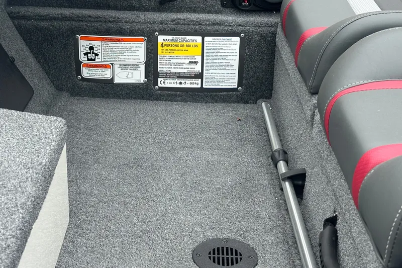 Slide: The Image of Interior of 2027 Ranger RT198P boat showing seating and safety labels. - 16
