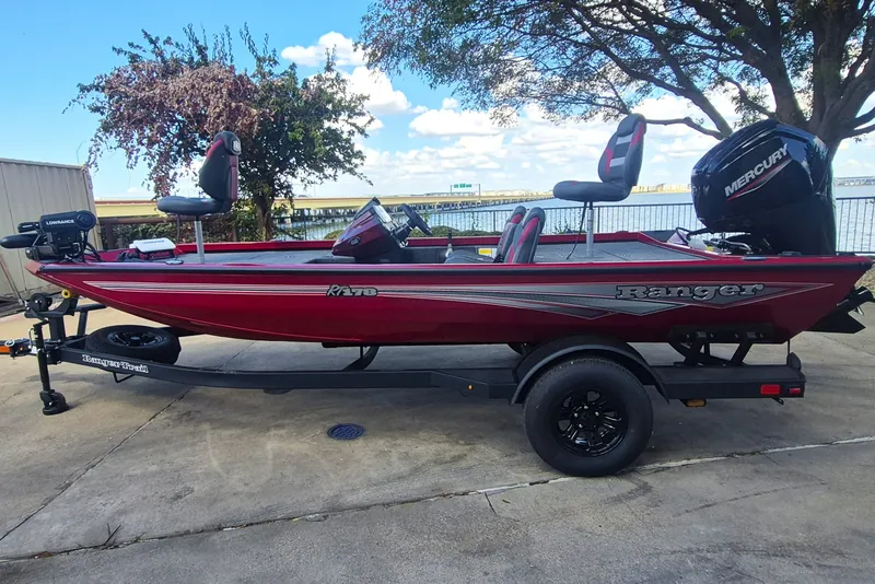 The Image of 2027 Ranger RT178 fishing boat with Mercury engine, parked on trailer by lakeside. - 0