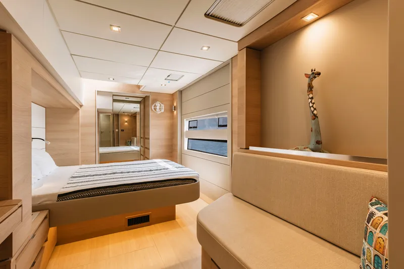 Slide: The Image of Luxurious interior of 2026 Aventura 56 Motor Yacht bedroom with modern decor. - 22