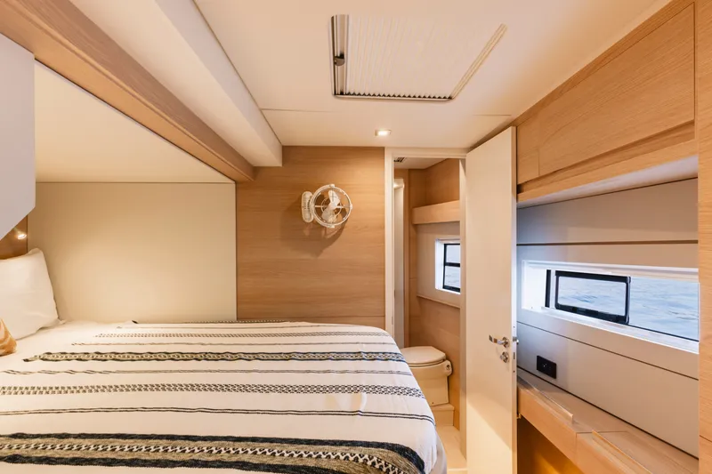 Slide: The Image of Luxurious bedroom interior of 2026 Aventura 56 Motor Yacht with modern design and ocean view. - 14