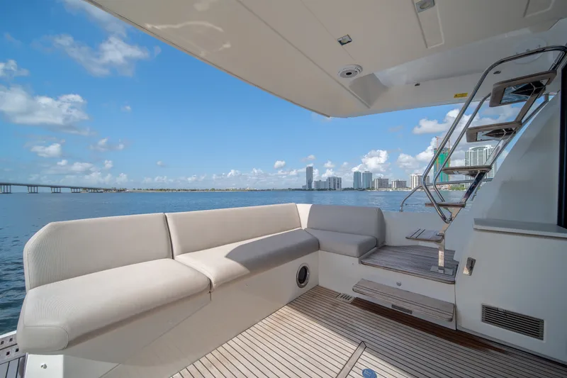 Slide: The Image of Luxurious 2020 Prestige 520 yacht deck with city skyline and ocean view. - 12