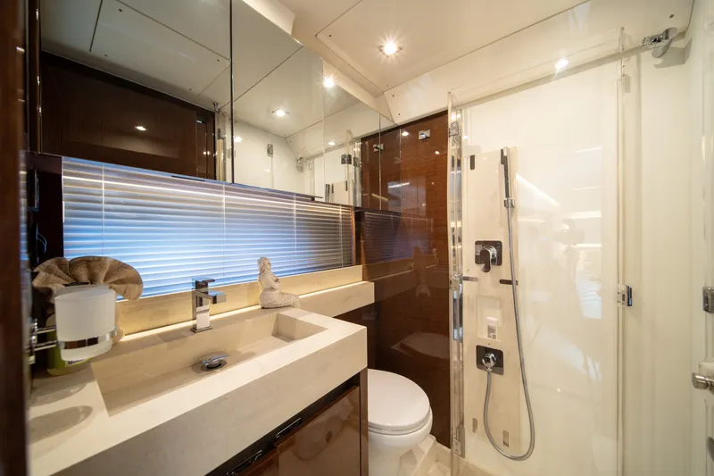Slide: The Image of Luxurious bathroom in a 2020 Prestige 520 yacht, featuring modern fixtures and elegant design. - 25